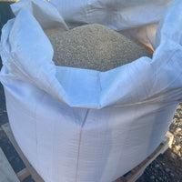 White bulk bag filled with grains from Far Out Feeds.